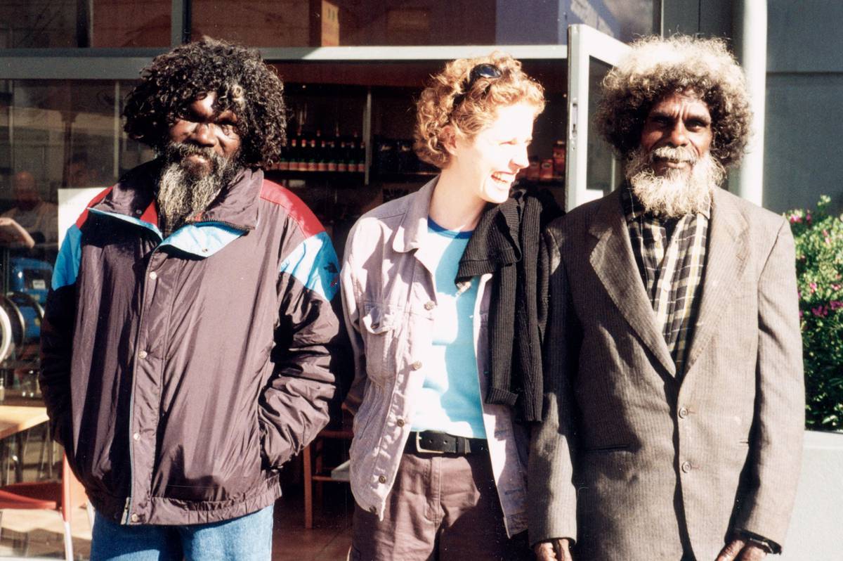 Ivan Namirrkki, Fiona Salmon and John Mawurndjul stand together outside