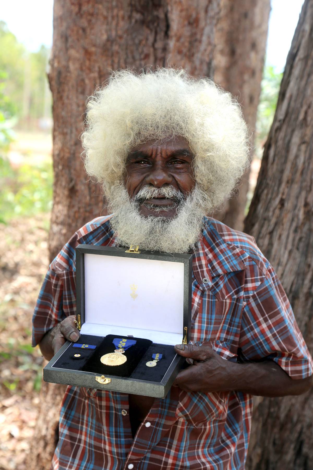 John Mawurndjul in Maningrida in 2017 with his medal received as Member of the Order of Australia (AM) in 2010.
